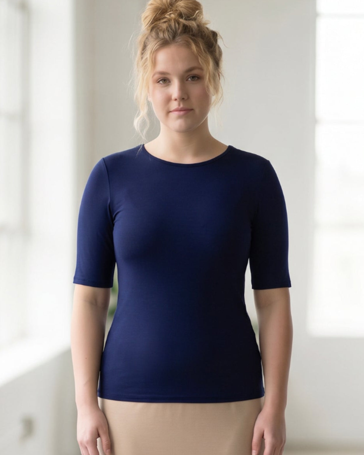 Model wearing the Nuggles® Essential Half Sleeve Tee in Navy