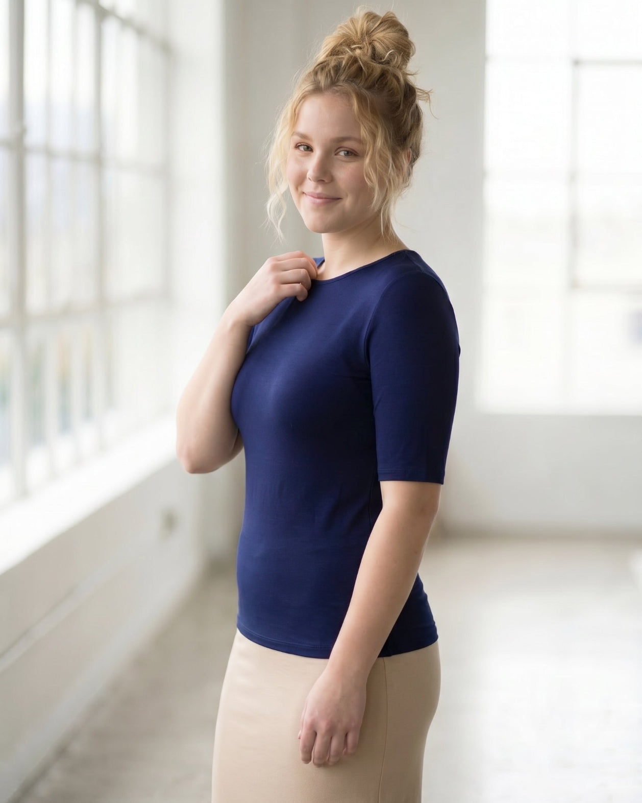 Model wearing the Nuggles® Essential Half Sleeve Tee in Navy