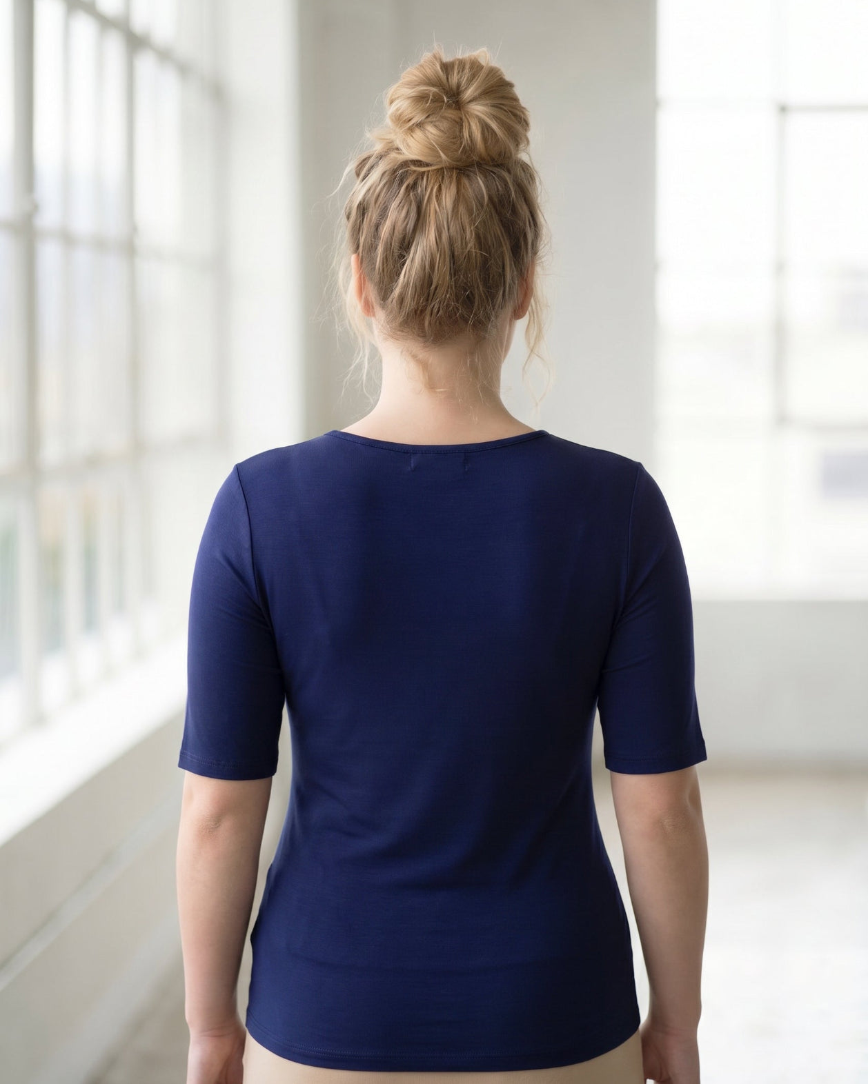 Model wearing the Nuggles® Essential Half Sleeve Tee in Navy