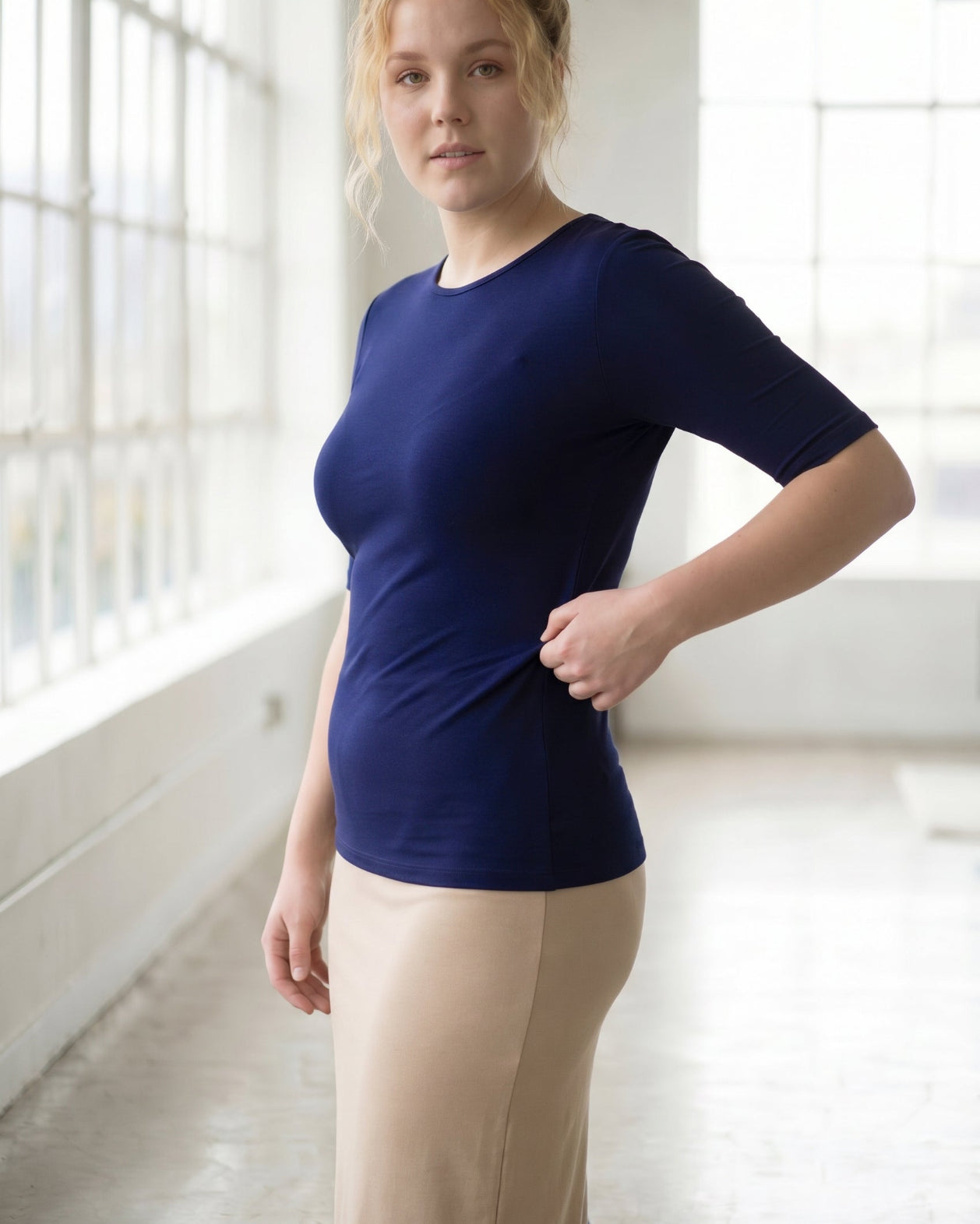 Model wearing the Nuggles® Essential Half Sleeve Tee in Navy