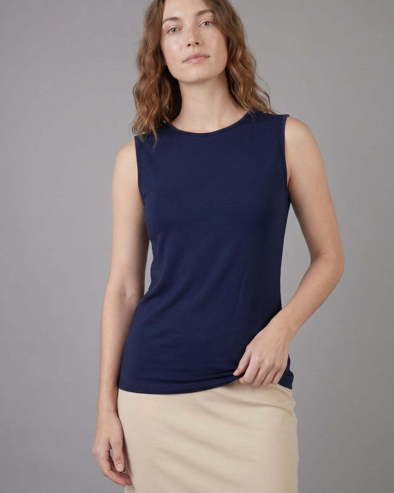 Model wearing Nuggles® Essential Tank in Navy