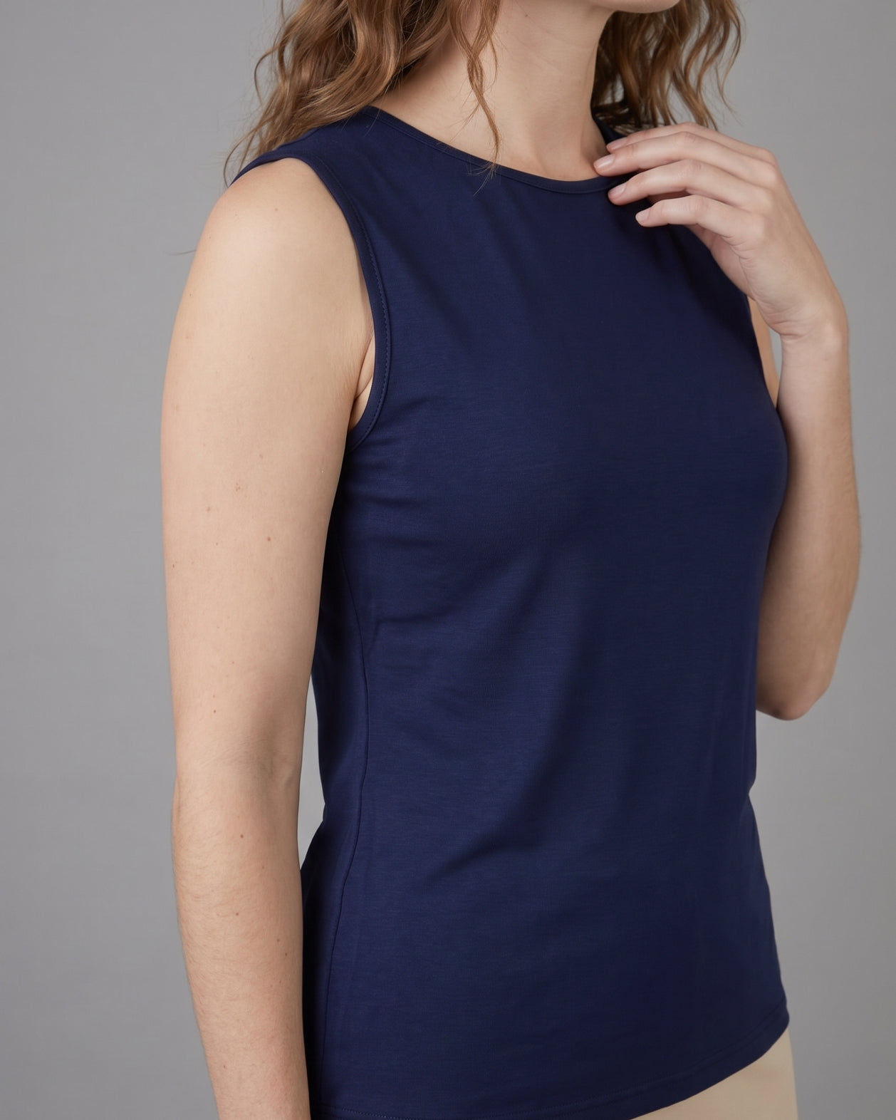 Model wearing Nuggles® Essential Tank in Navy