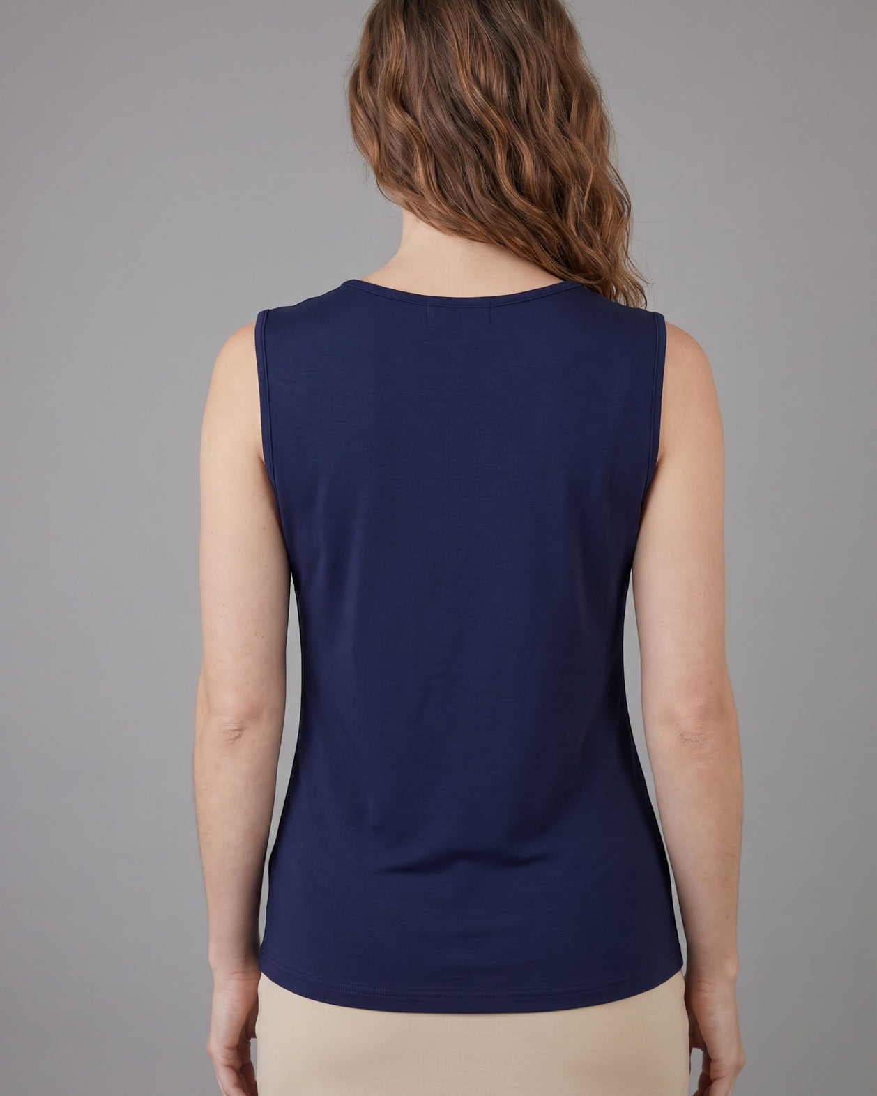Model wearing Nuggles® Essential Tank in Navy