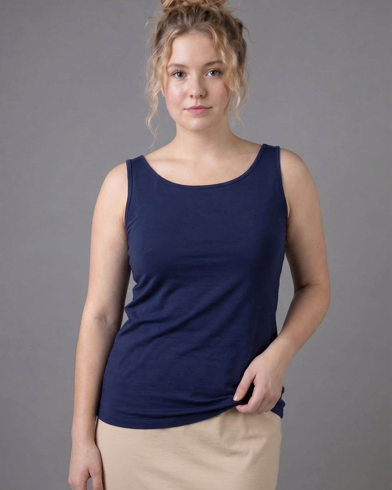 Model wearing Nuggles® Wide Neck Tank in Navy