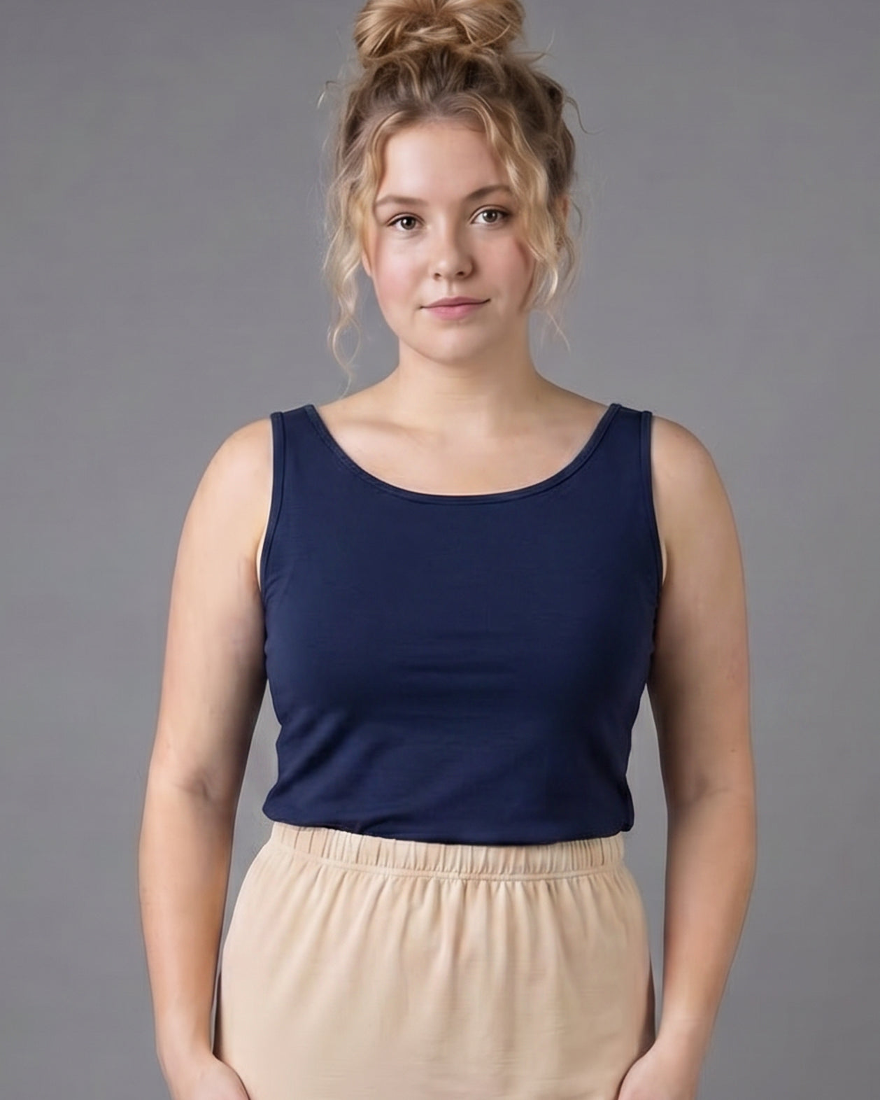 Model wearing Nuggles® Wide Neck Tank in Navy