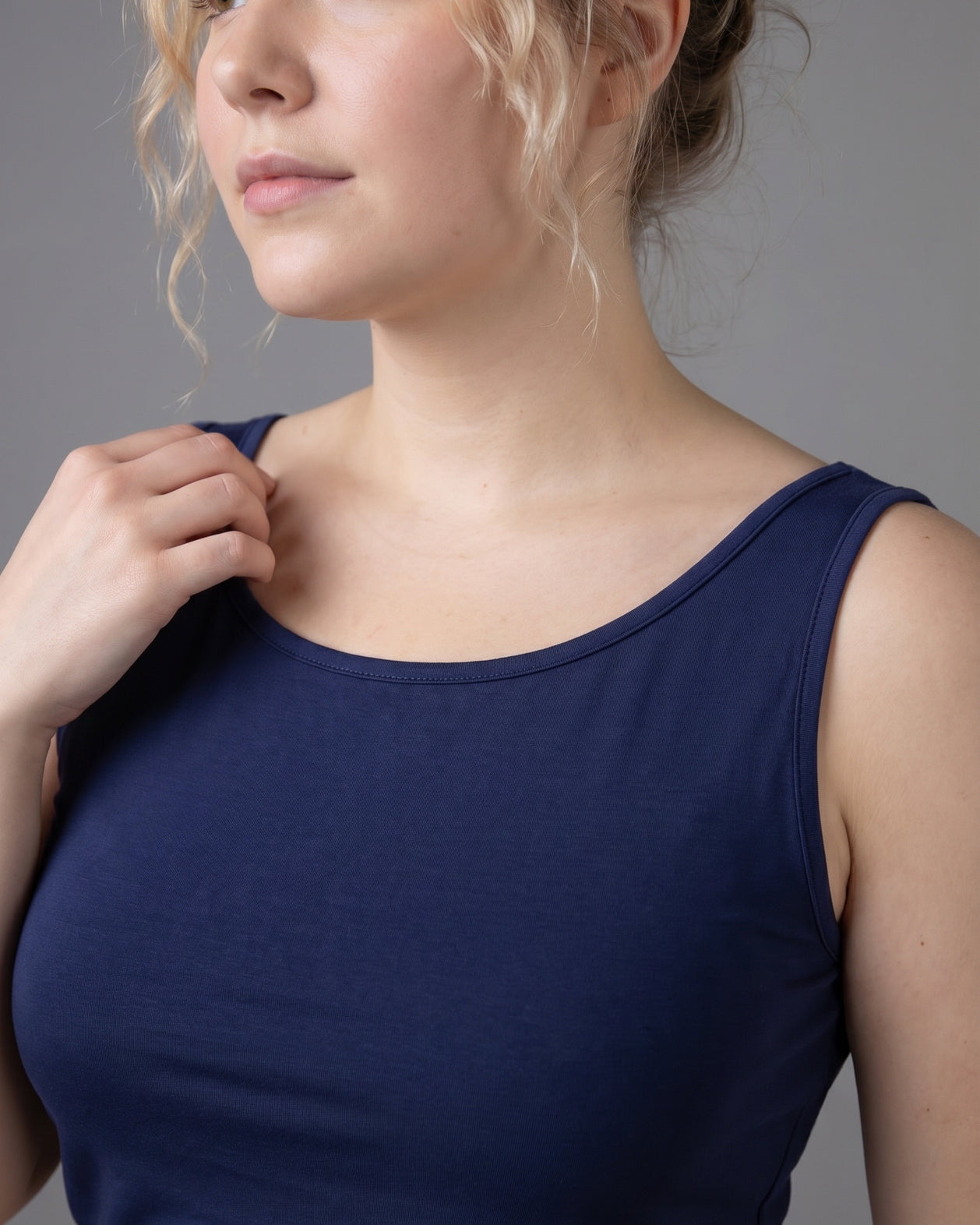 Model wearing Nuggles® Wide Neck Tank in Navy