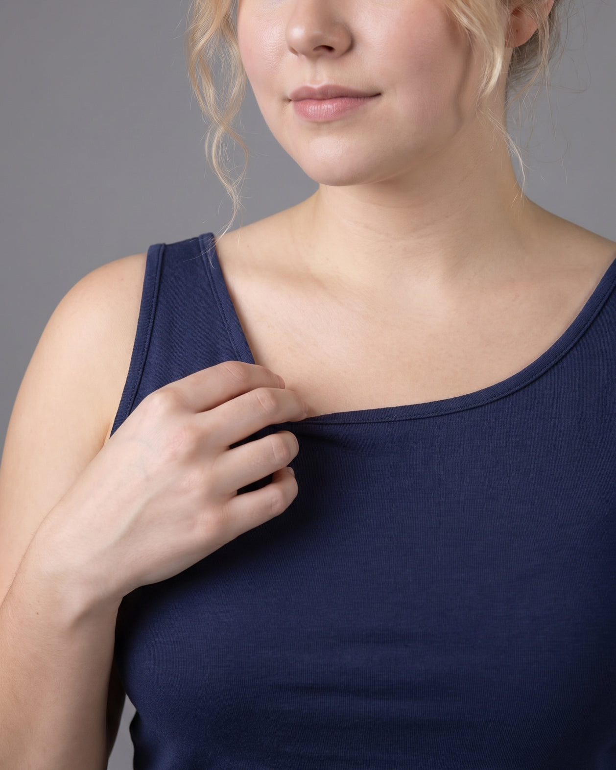 Model wearing Nuggles® Wide Neck Tank in Navy