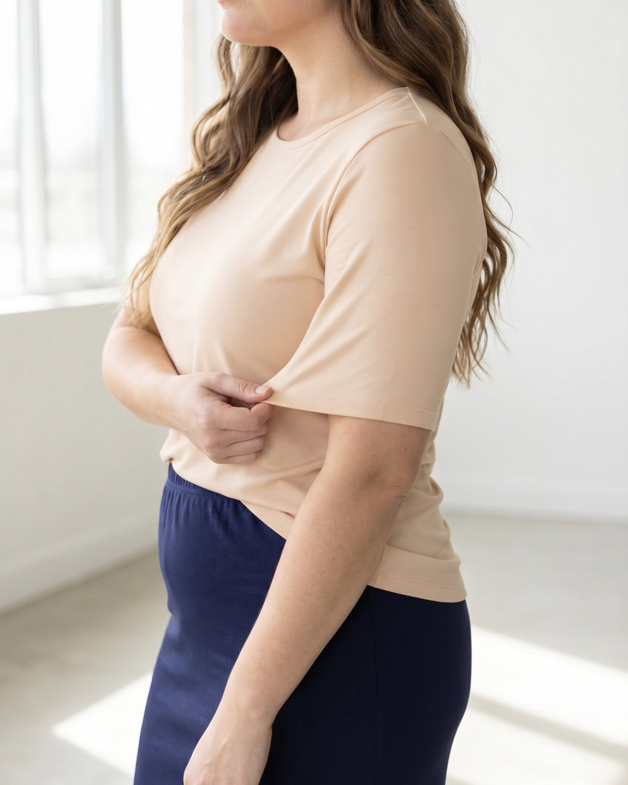 Model wearing the Nuggles® Essential Half Sleeve Tee in Nude