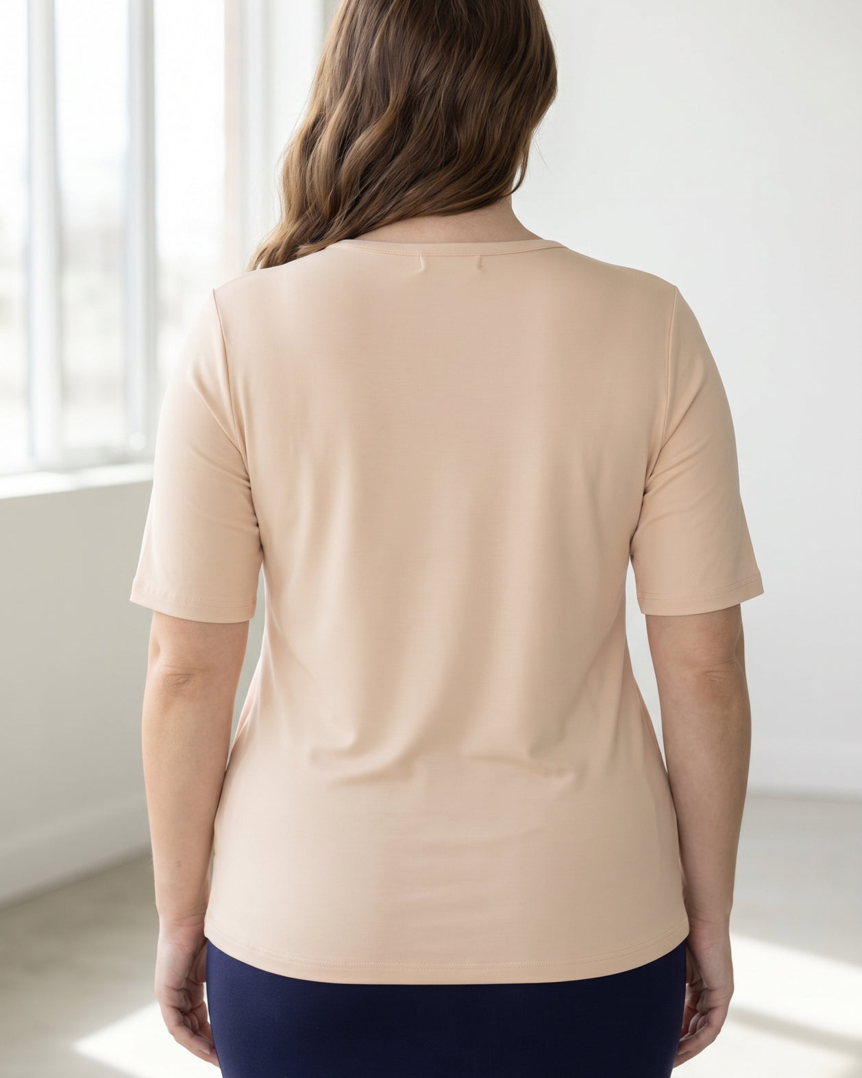 Model wearing the Nuggles® Essential Half Sleeve Tee in Nude