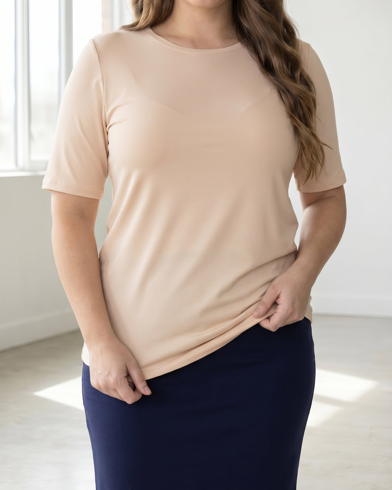 Model wearing the Nuggles® Essential Half Sleeve Tee in Nude