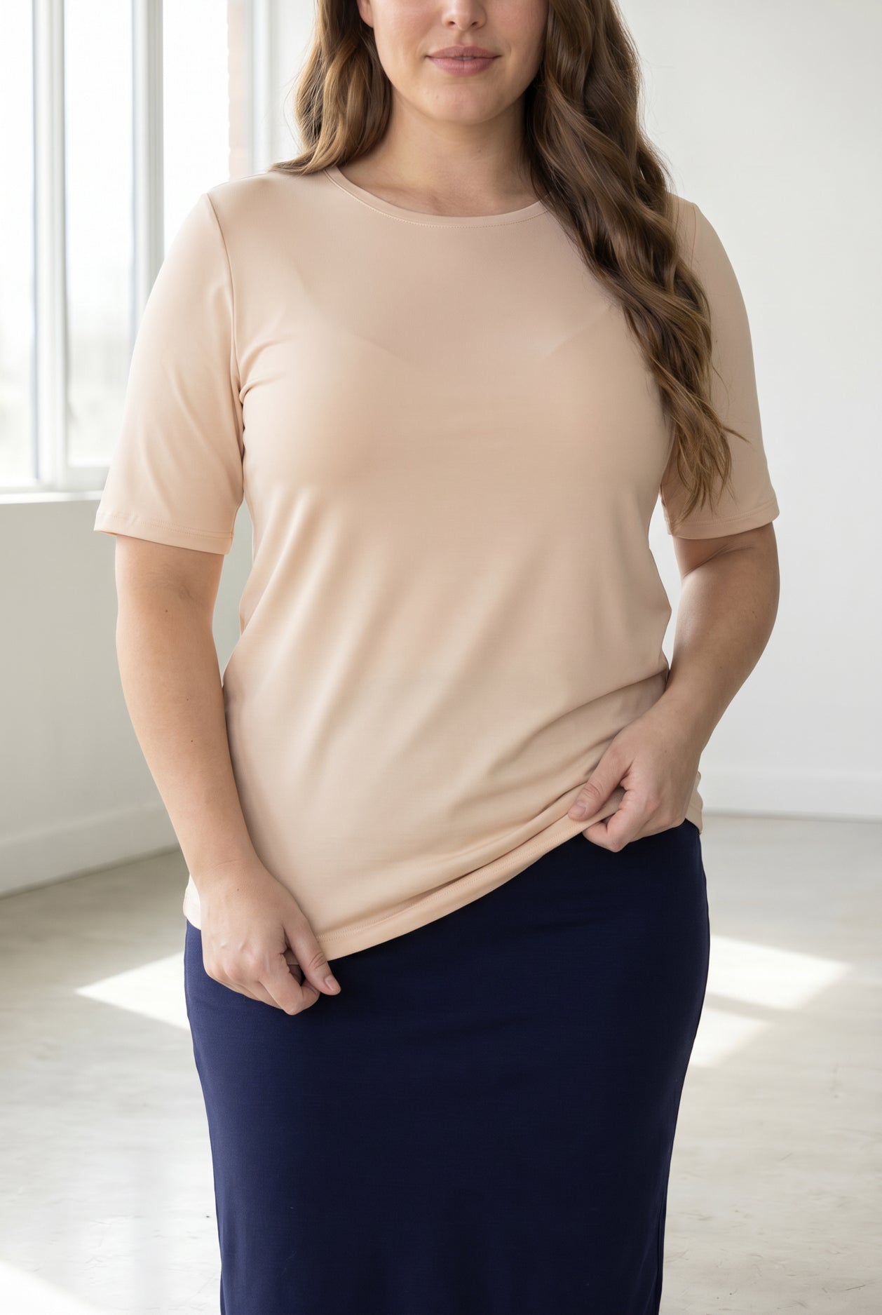 Model wearing the Nuggles® Essential Half Sleeve Tee in Nude