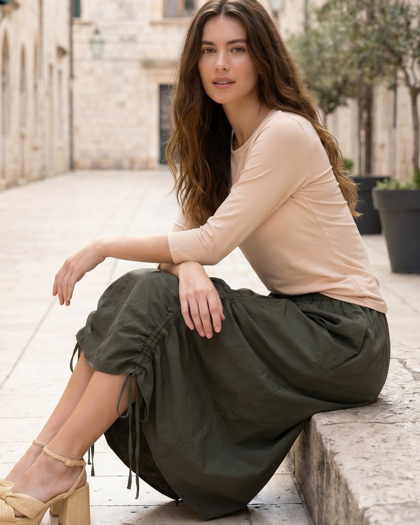 Model wearing Nuggles® Oriana Skirt in Olive Green