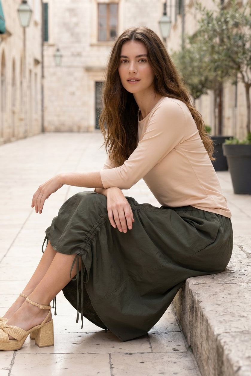 Model wearing Nuggles® Oriana Skirt in Olive Green