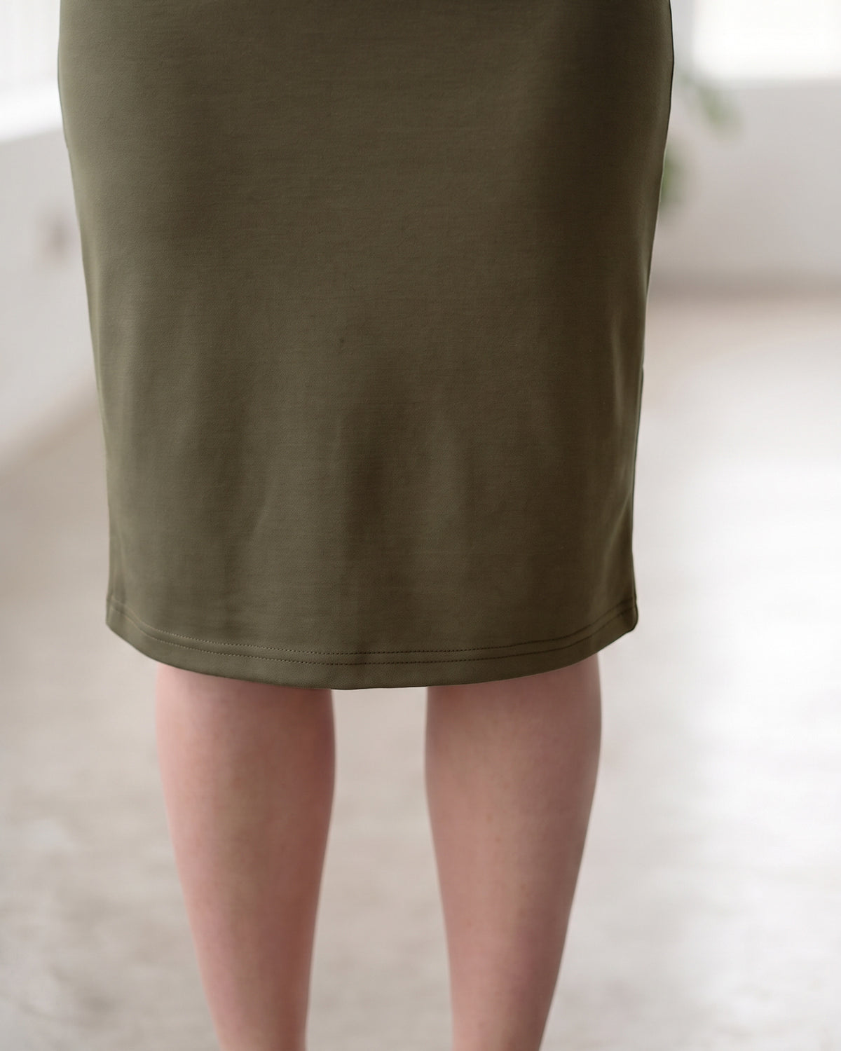 Model wearing Nuggles® 27" Classic Skirt in Olive Brown
