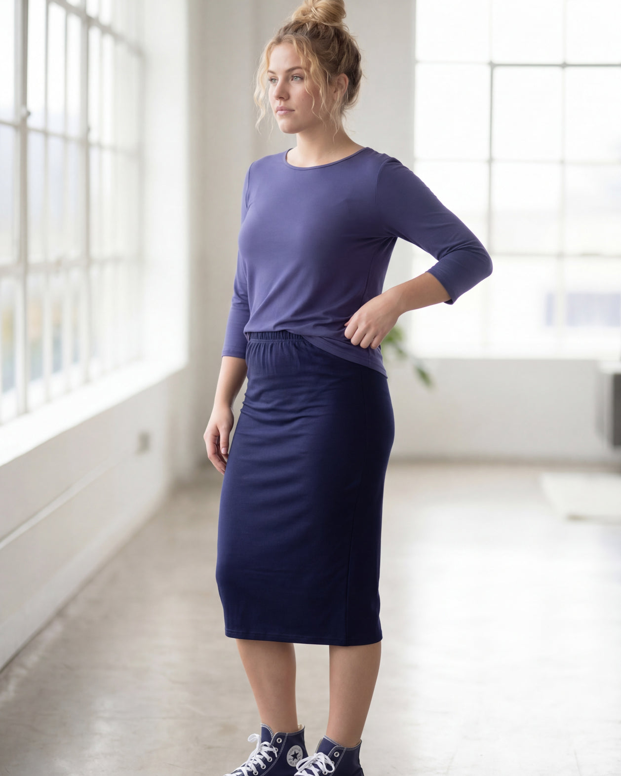 Model wearing Nuggles® 3/4 Essential Tee in Periwinkle Purple