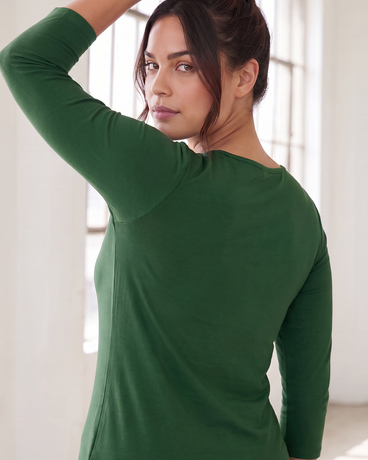 Model wearing Nuggles® Essential 3/4 Tee in Pine Green