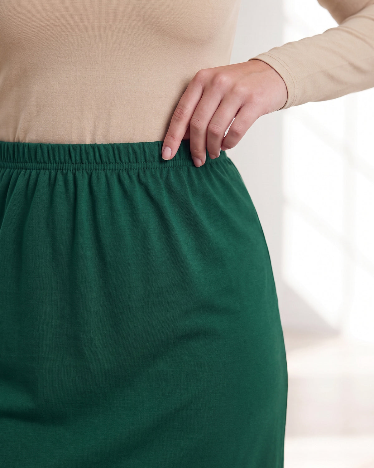 Model wearing Nuggles® 31" Classic Skirt in Pine Green