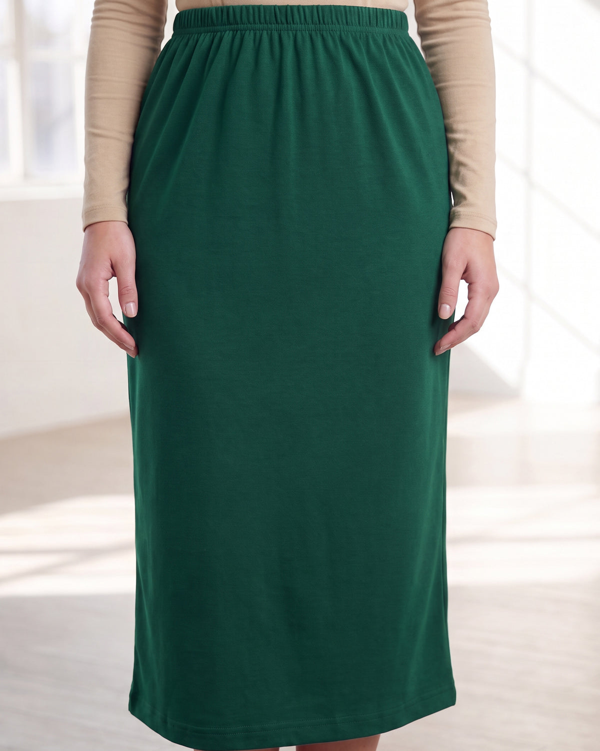 Model wearing Nuggles® 31" Classic Skirt in Pine Green