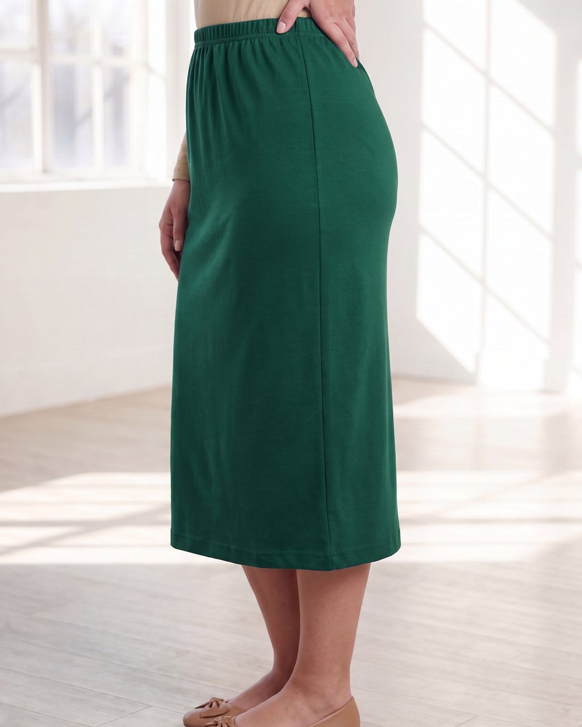 Model wearing Nuggles® 31" Classic Skirt in Pine Green