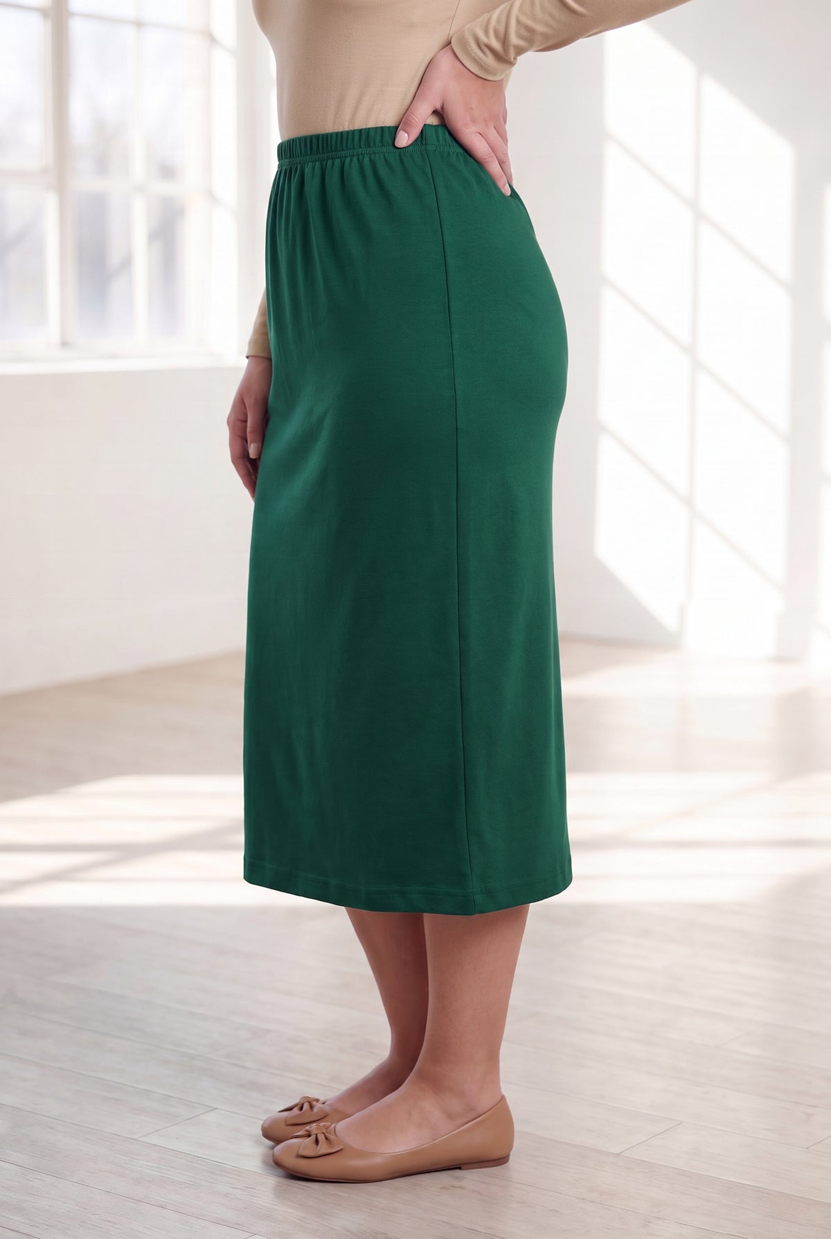 Model wearing Nuggles® 31" Classic Skirt in Pine Green