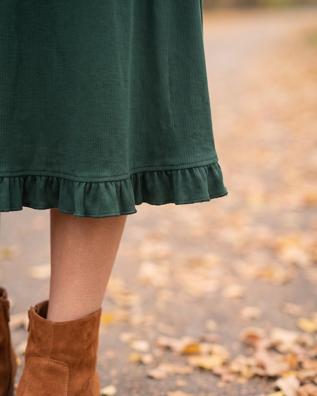 Model wearing Nuggles® Bethany Shirt & Skirt in Pine Green
