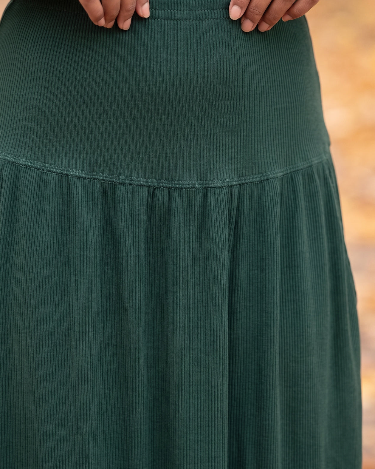Model wearing Nuggles® Bethany Shirt & Skirt in Pine Green