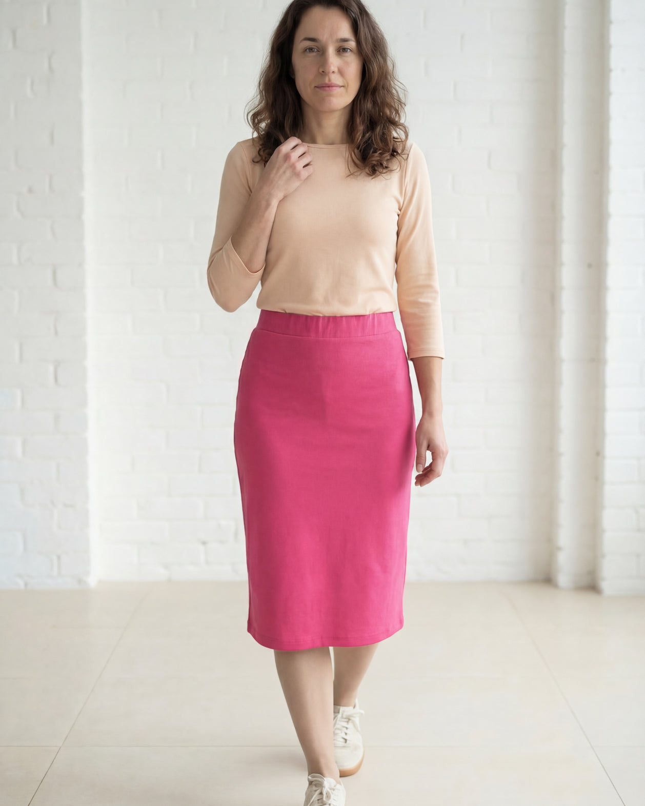 Model wearing Nuggles® 27" Relaxed Midi Skirt in Pink