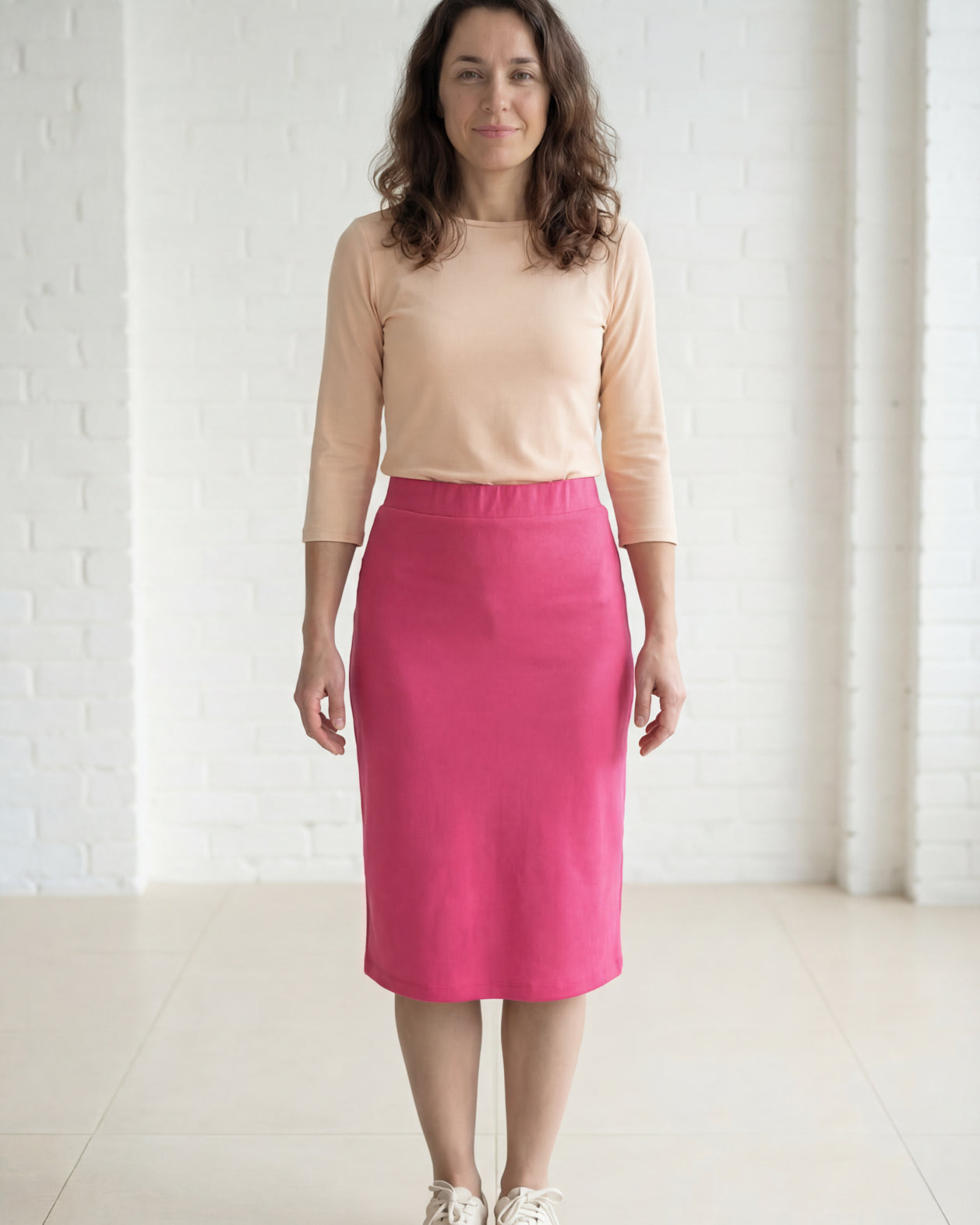 Model wearing Nuggles® 27" Relaxed Midi Skirt in Pink
