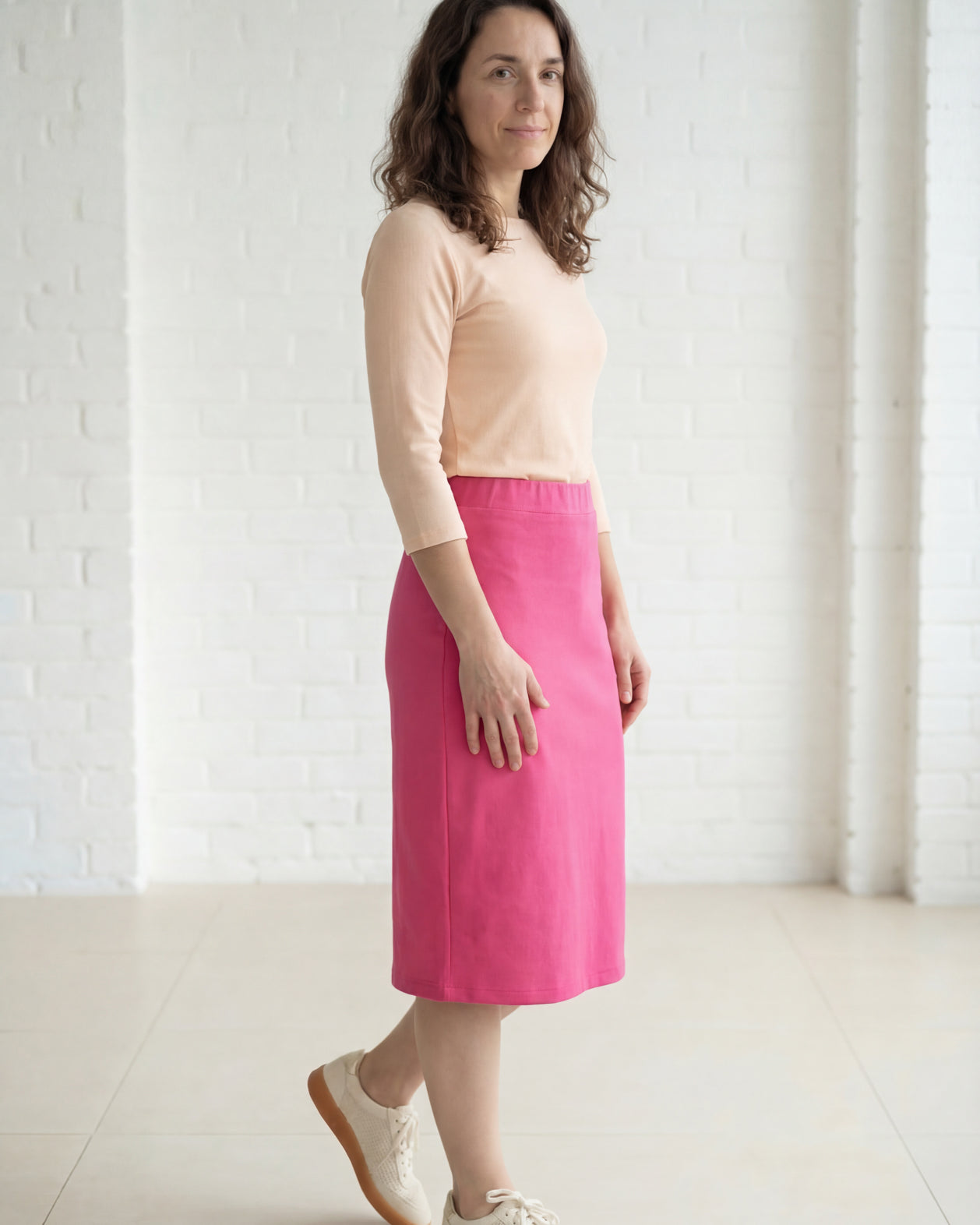 Model wearing Nuggles® 27" Relaxed Midi Skirt in Pink