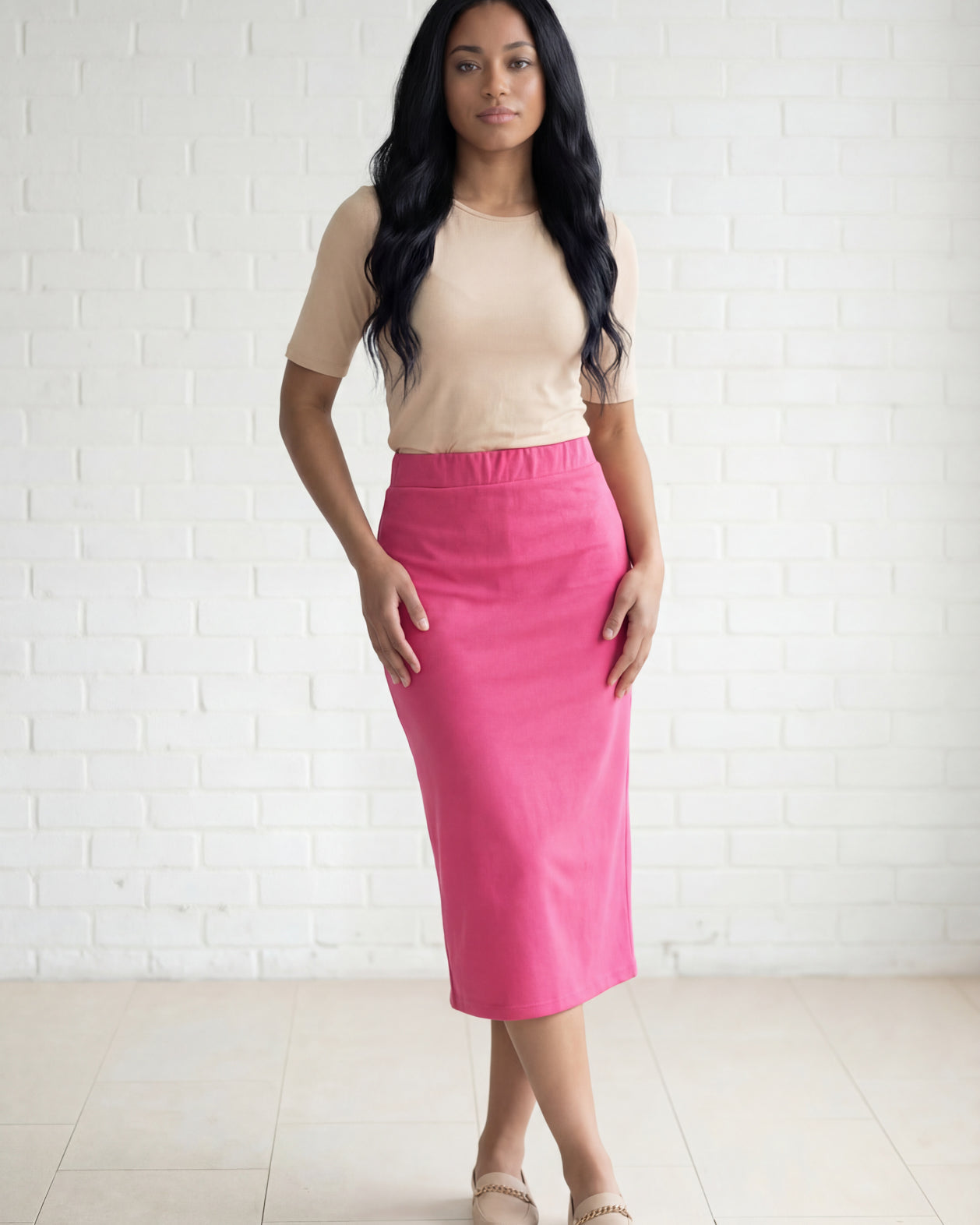 Model wearing Nuggles® 31" Relaxed Midi Skirt in Pink