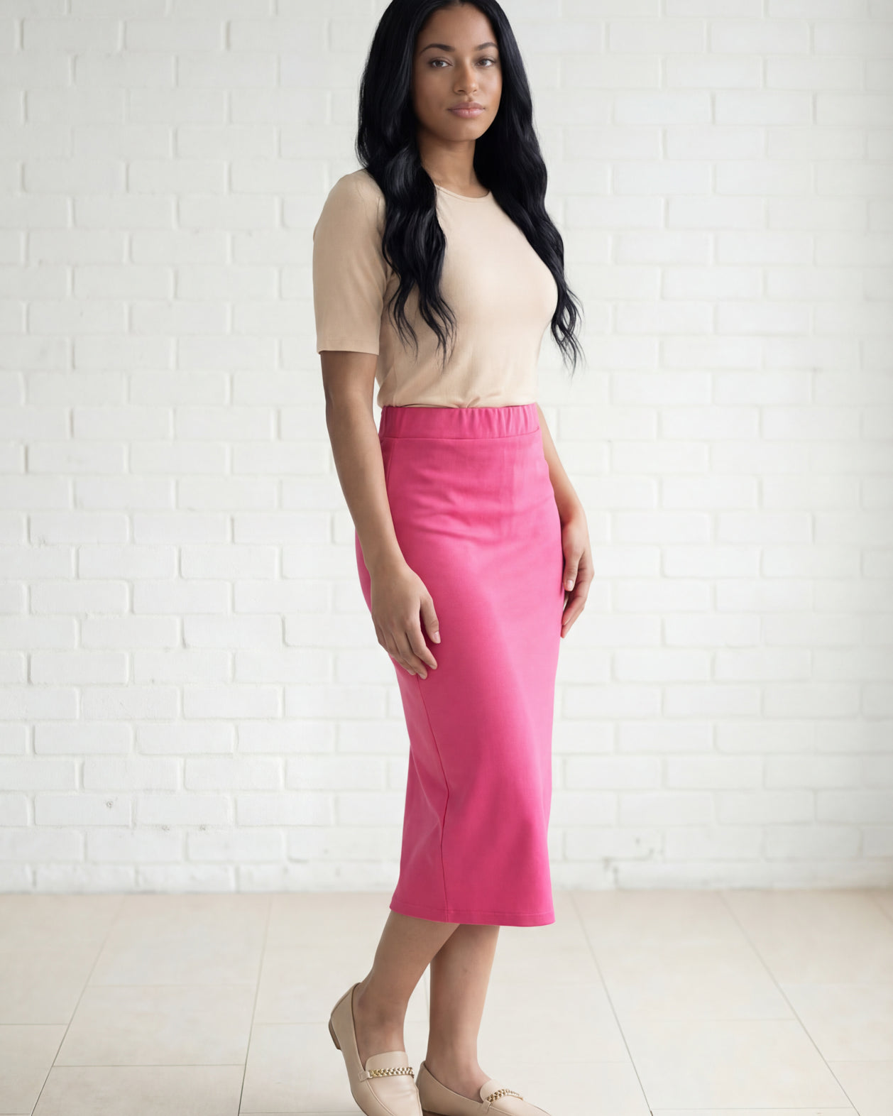 Model wearing Nuggles® 31" Relaxed Midi Skirt in Pink