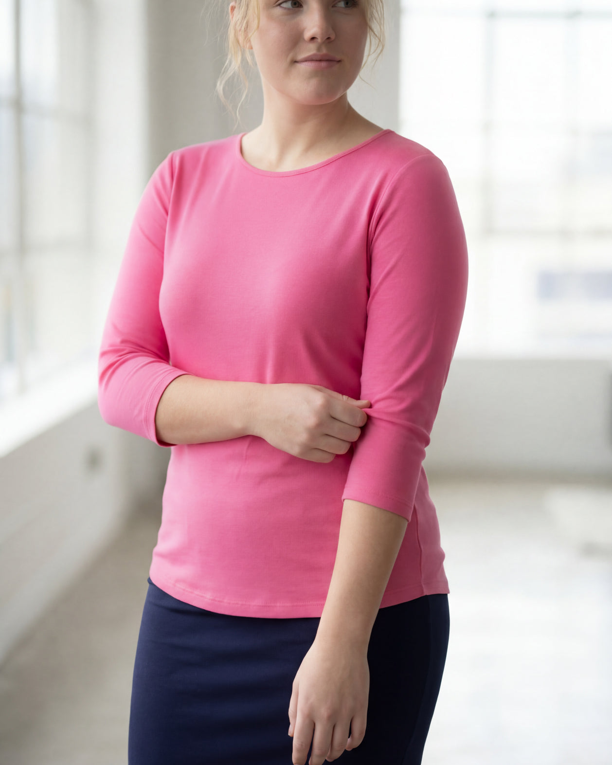 Model wearing Nuggles® 3/4 Essential Tee in Pink