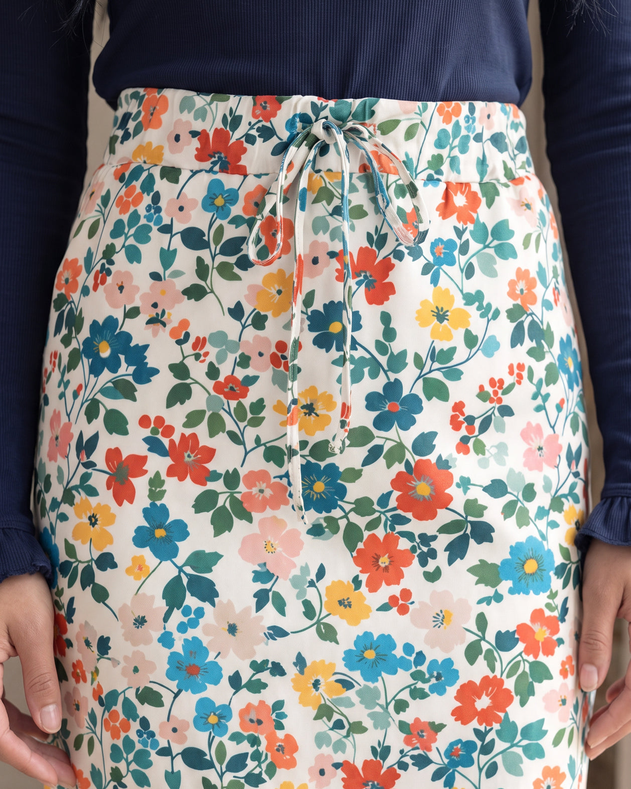 Model wearing Nuggles® 31" Drawstring Skirt in Posy Lane