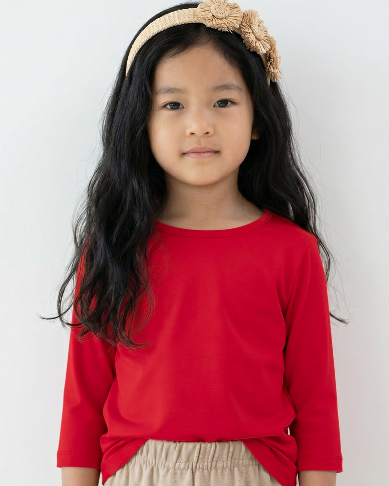 Model wearing the Girls' Nuggles® Essential 3/4 Tee in Red