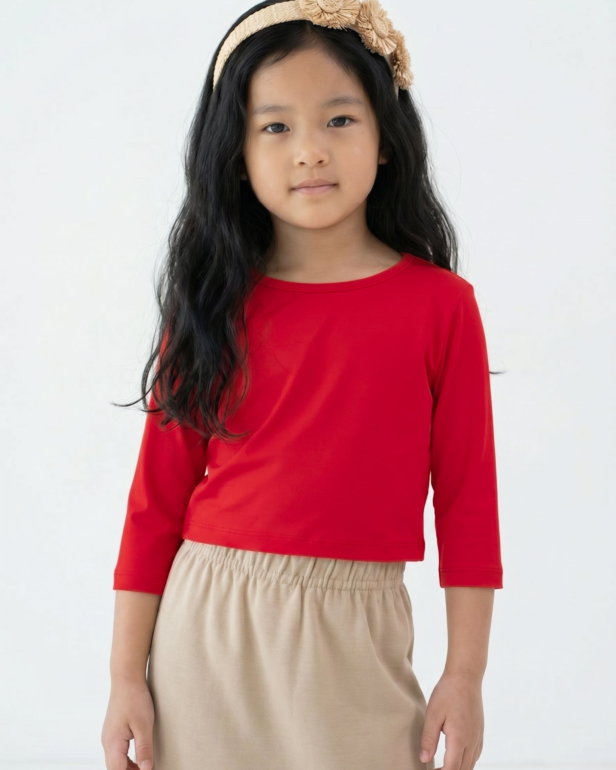 Model wearing the Girls' Nuggles® Essential 3/4 Tee in Red