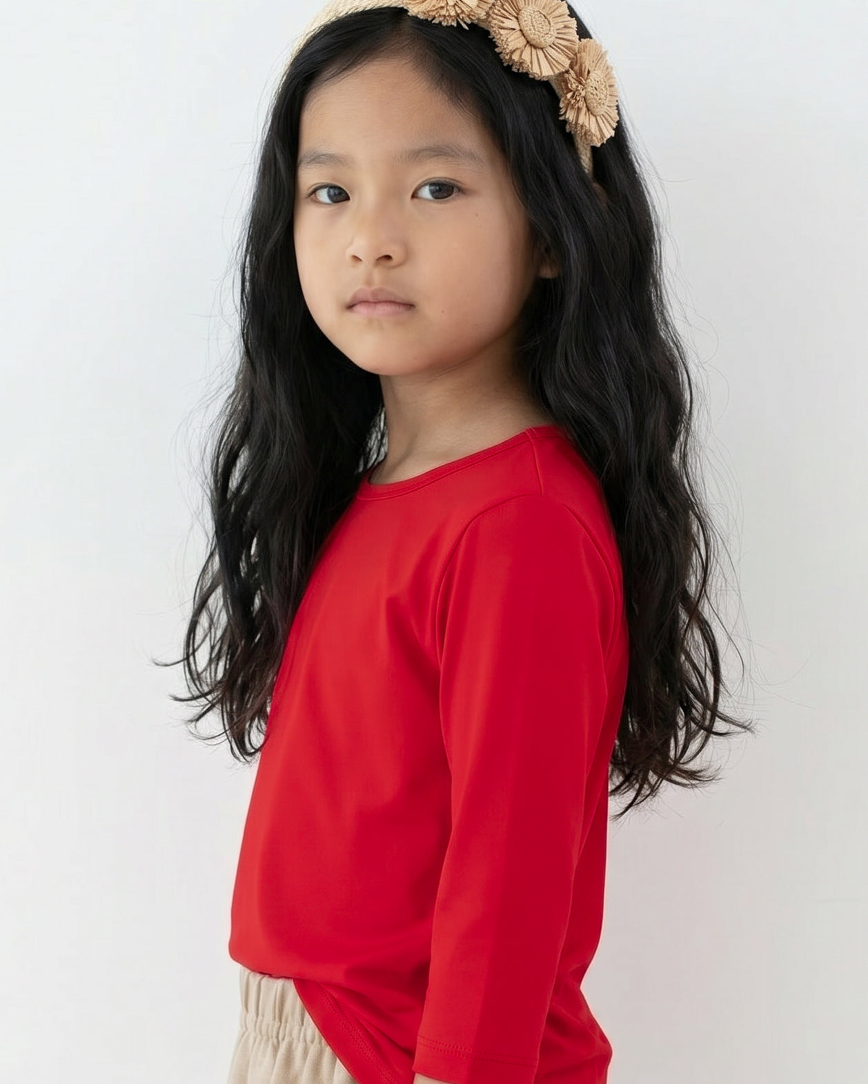 Model wearing the Girls' Nuggles® Essential 3/4 Tee in Red