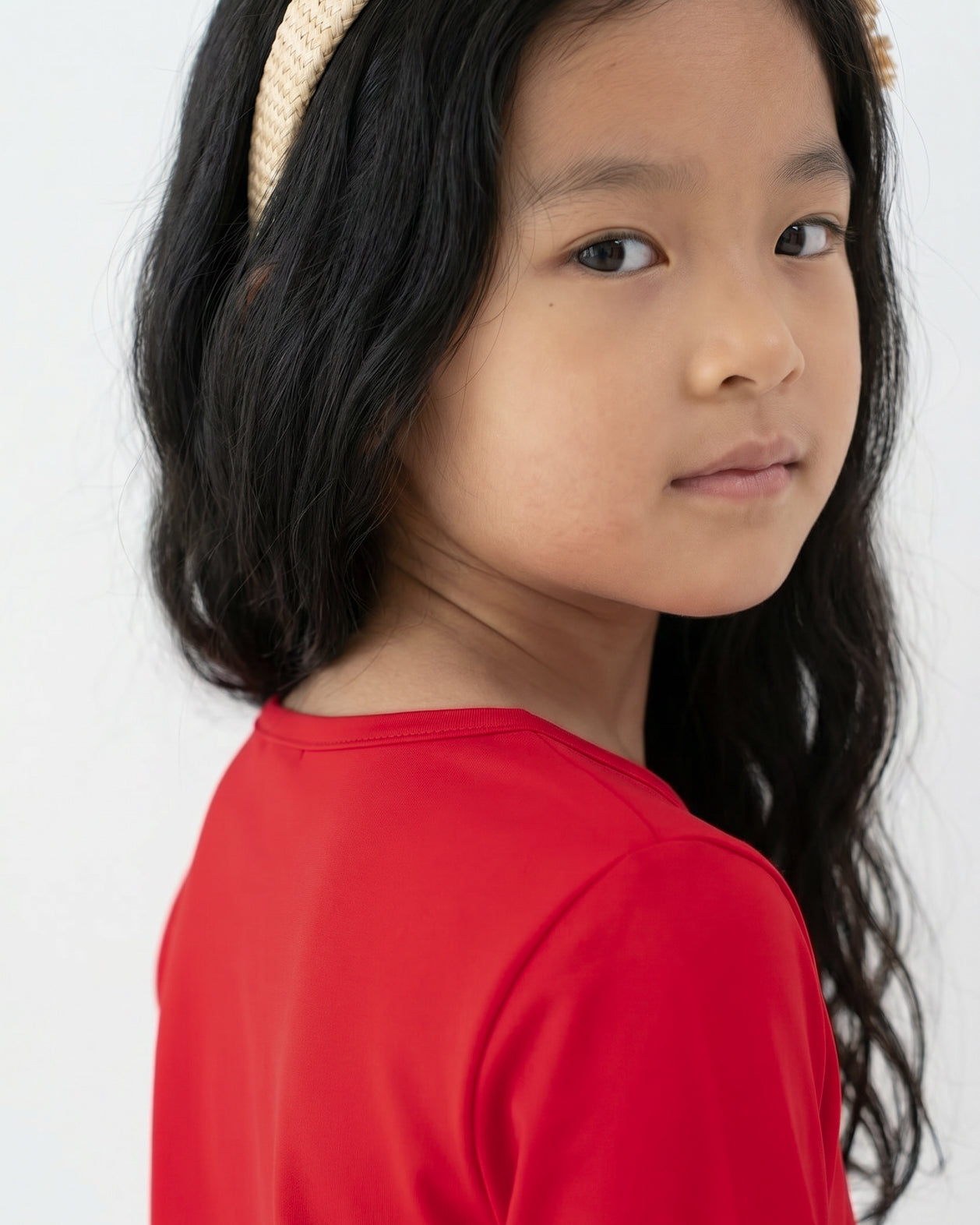 Model wearing the Girls' Nuggles® Essential 3/4 Tee in Red