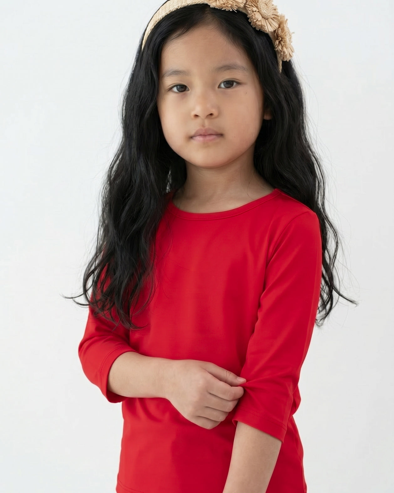 Model wearing the Girls' Nuggles® Essential 3/4 Tee in Red