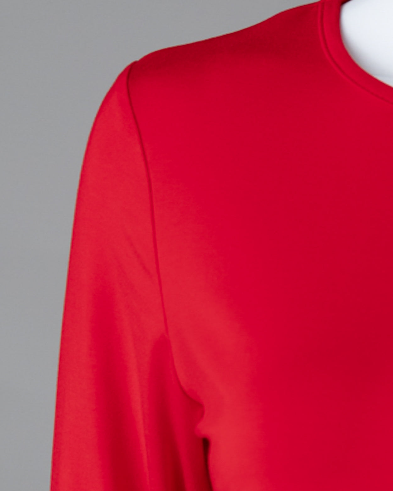 Model wearing the Girls' Nuggles® Essential 3/4 Tee in Red