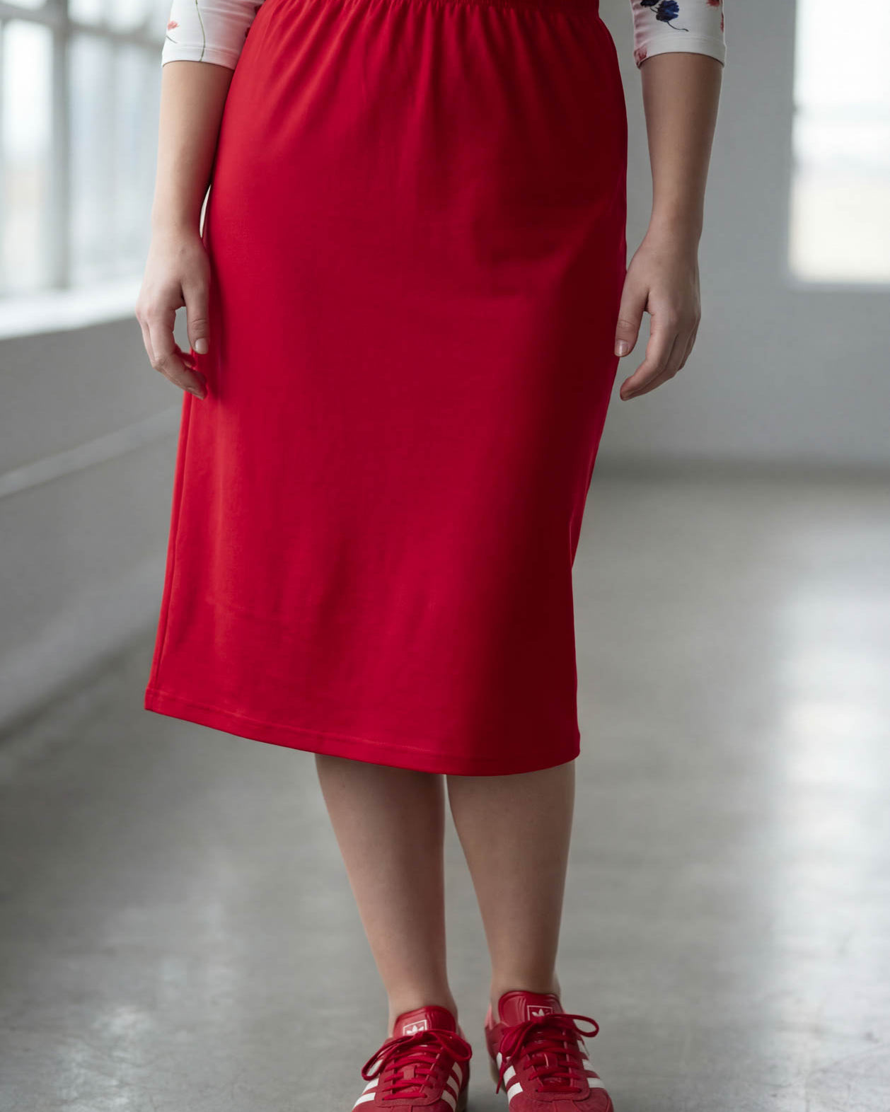 Model wearing Nuggles® 27" Classic Skirt in Red