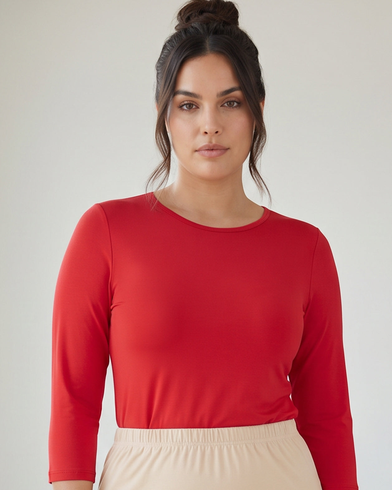 Model wearing Nuggles® 3/4 Essential Tee in Red