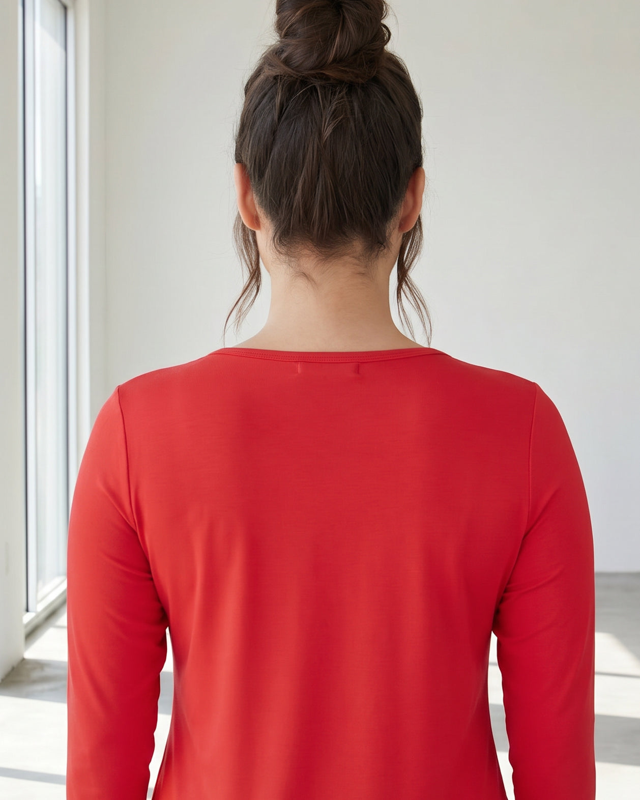 Model wearing Nuggles® 3/4 Essential Tee in Red