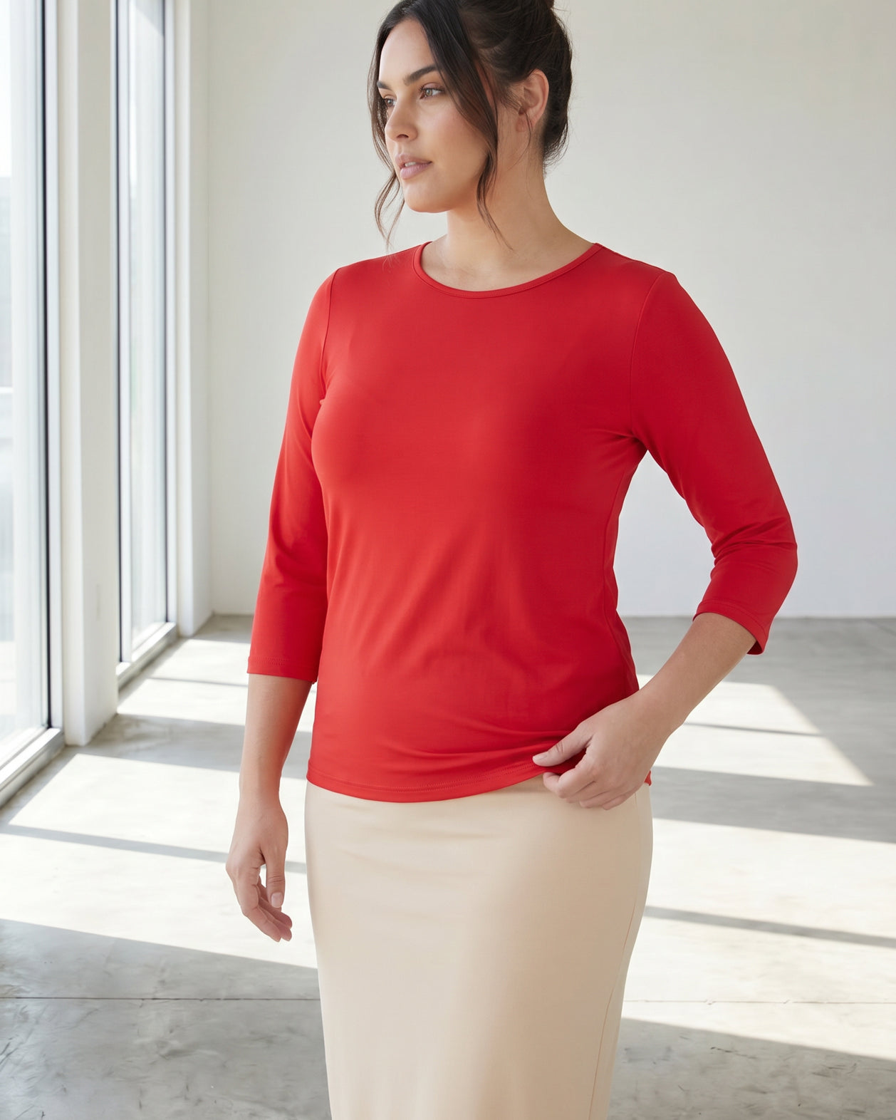 Model wearing Nuggles® 3/4 Essential Tee in Red