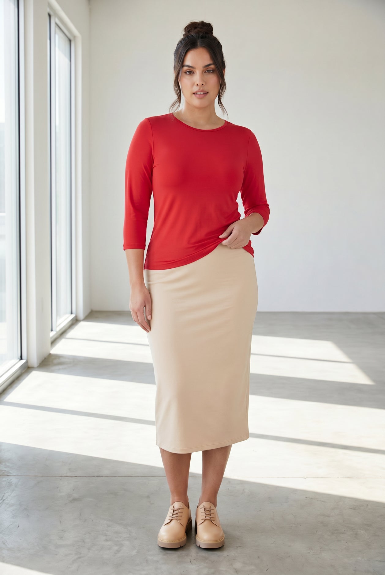 Model wearing Nuggles® 3/4 Essential Tee in Red