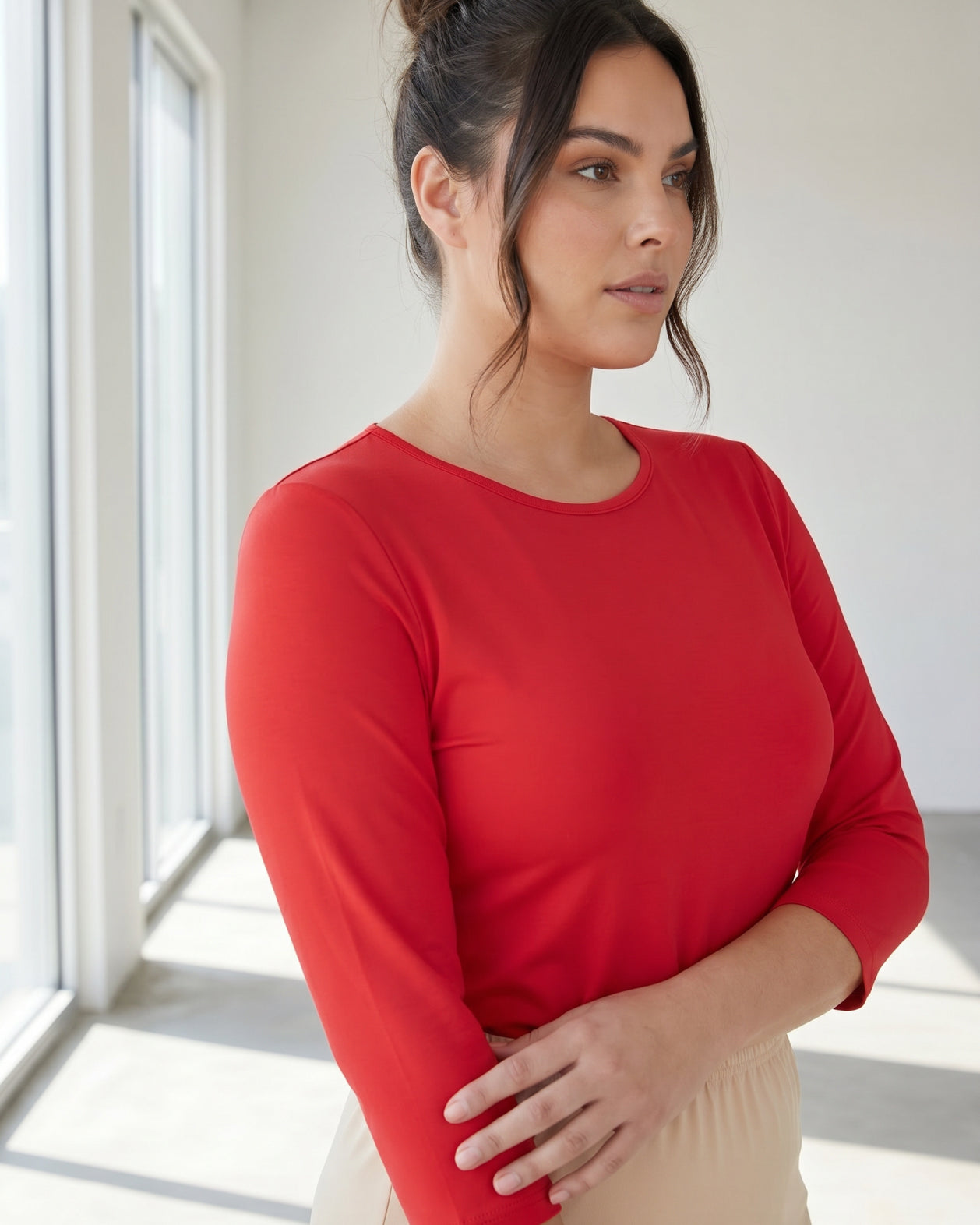 Model wearing Nuggles® 3/4 Essential Tee in Red