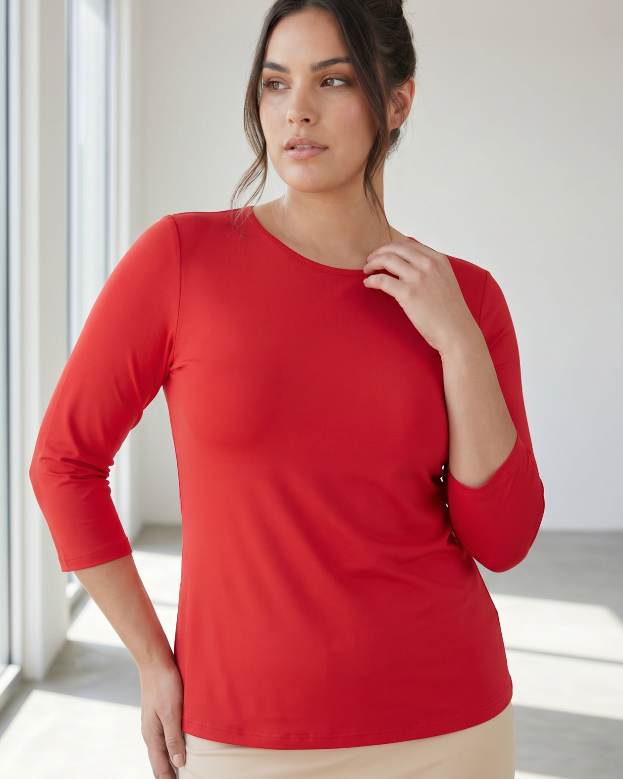 Model wearing Nuggles® 3/4 Essential Tee in Red
