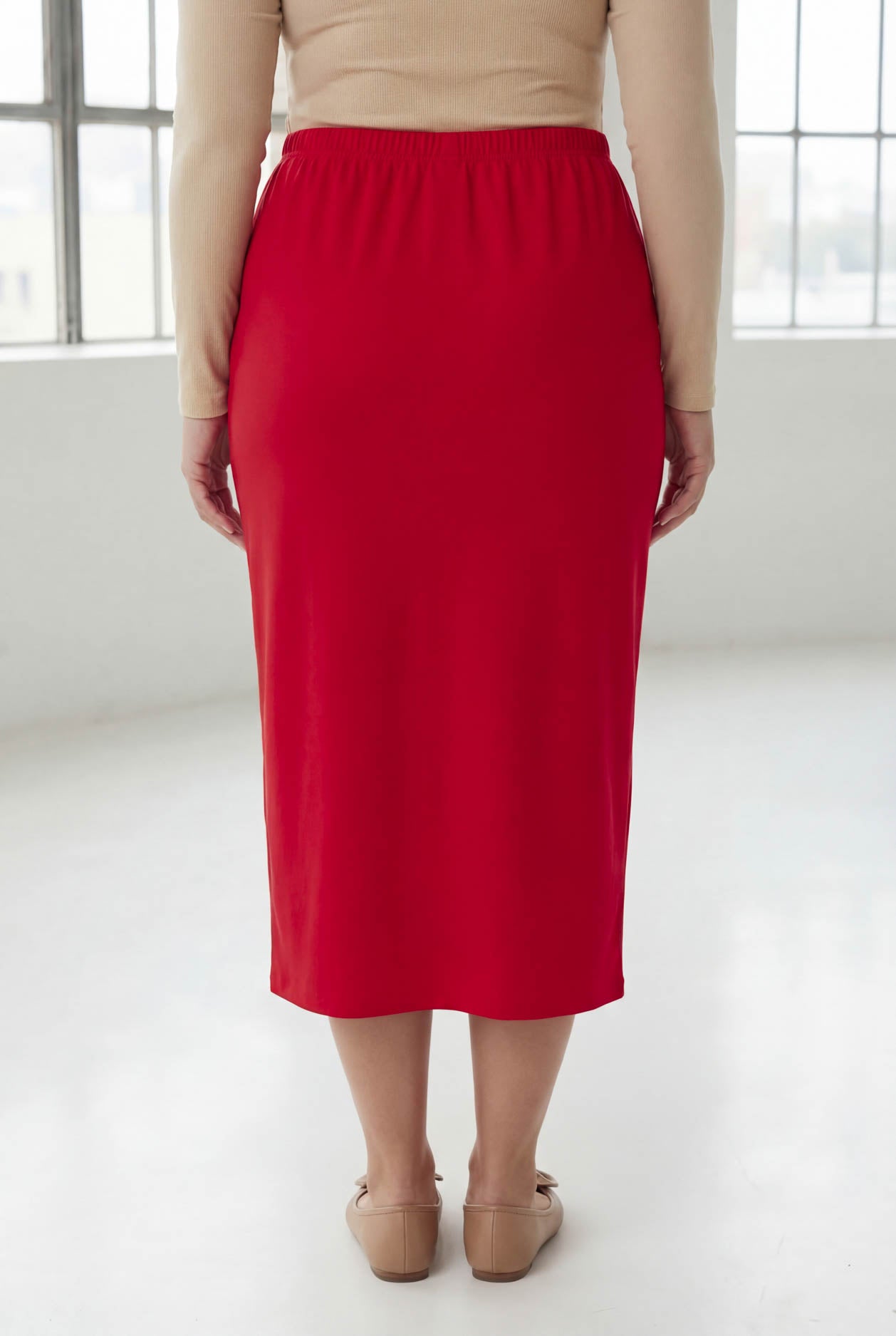 Model wearing Nuggles® 31" Classic Skirt in Red