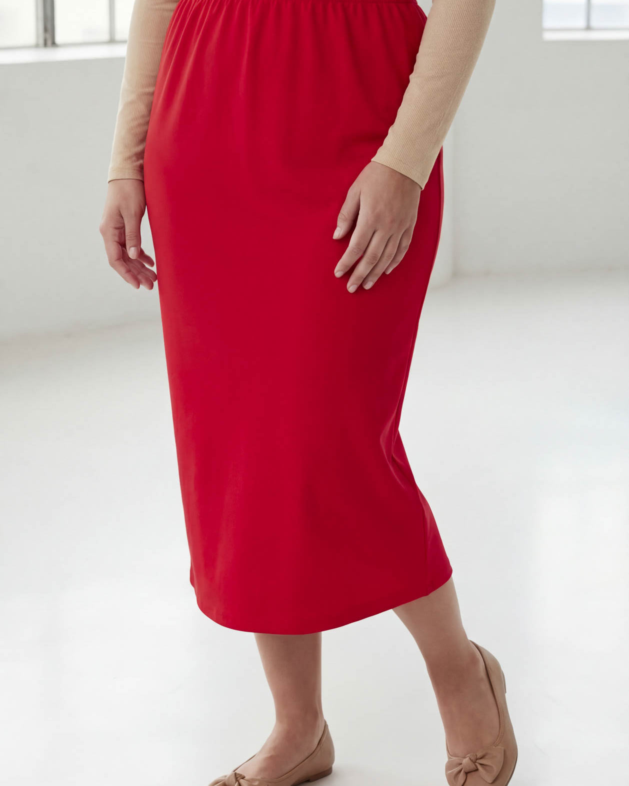 Model wearing Nuggles® 31" Classic Skirt in Red