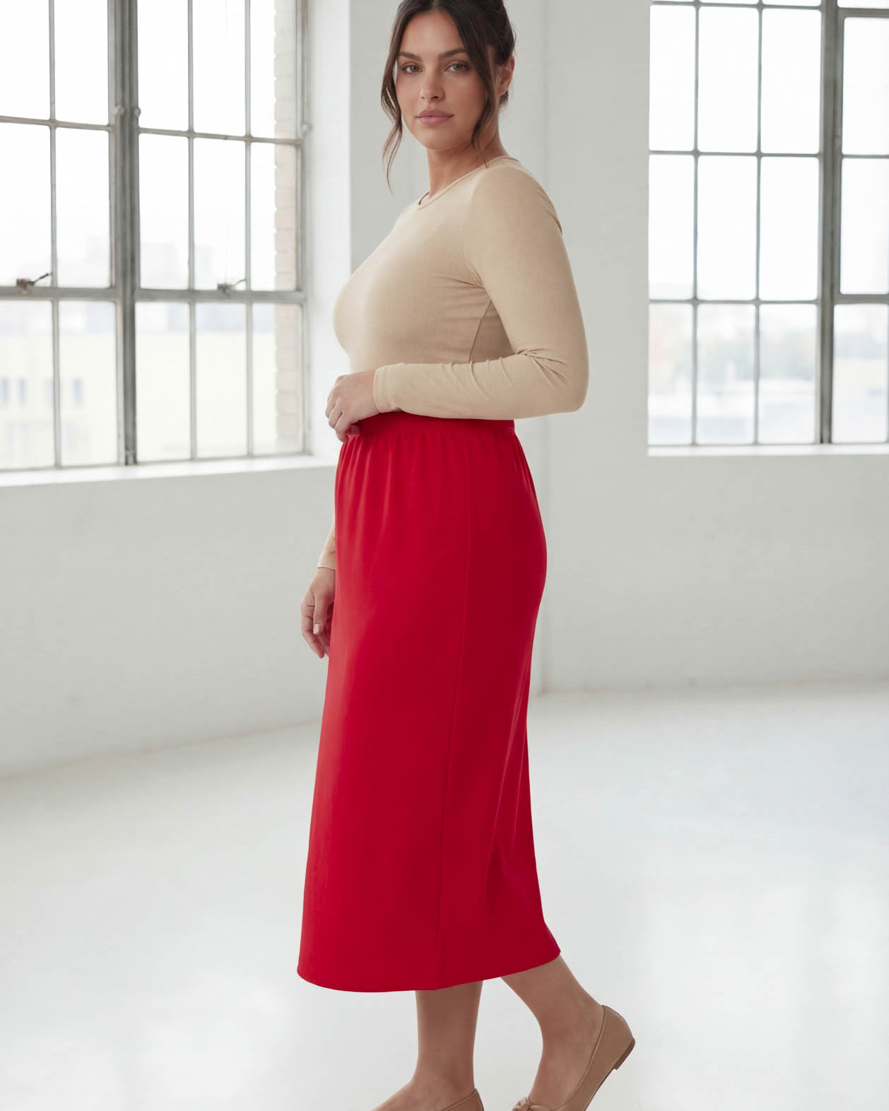 Model wearing Nuggles® 31" Classic Skirt in Red