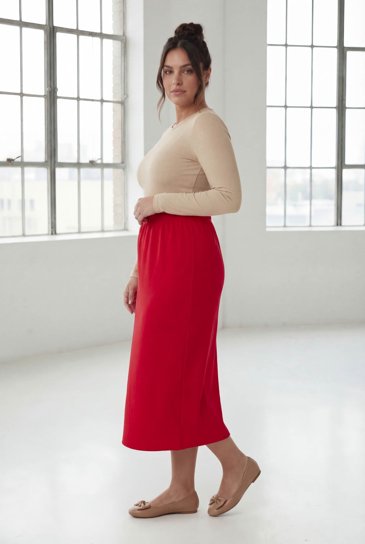 Model wearing Nuggles® 31" Classic Skirt in Red